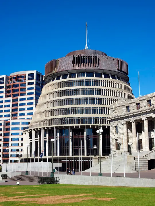 A round modern government tower with a stepped base.
