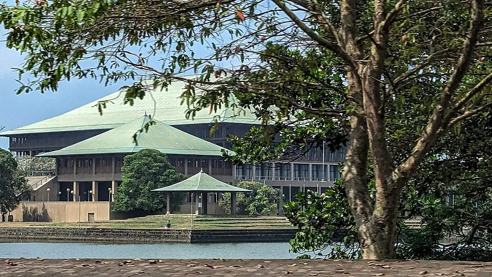 A parliament complex on an island in a lake.