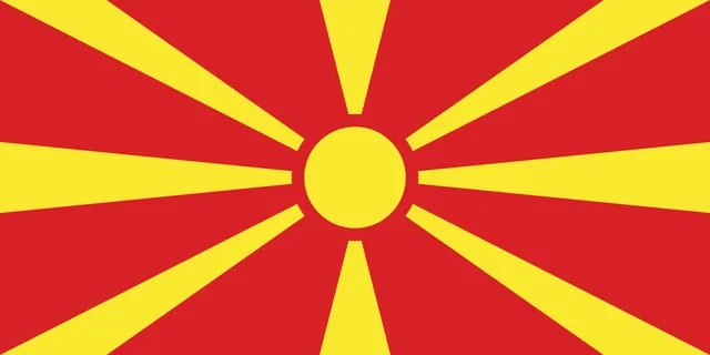 Red flag with a yellow sun sending eight broadening rays to the edges