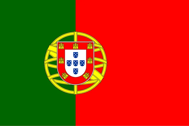 Green and red field with a yellow sphere and a shield on the line between the colours