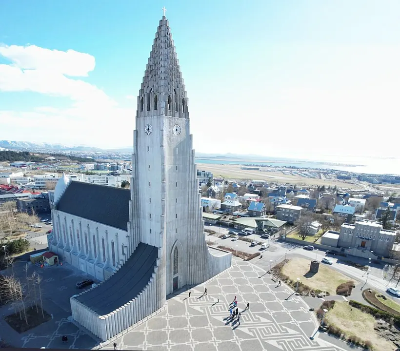A tall concrete church tower shaped like stepped basalt columns.