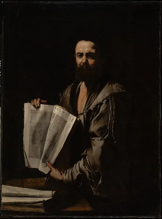 A bust or painting of an ancient bearded Greek scholar.