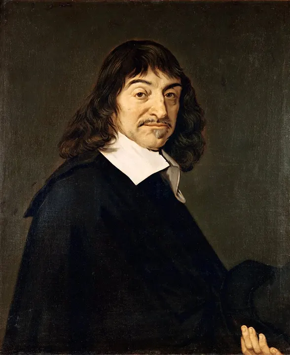 A portrait of a man with long hair and a white collar.