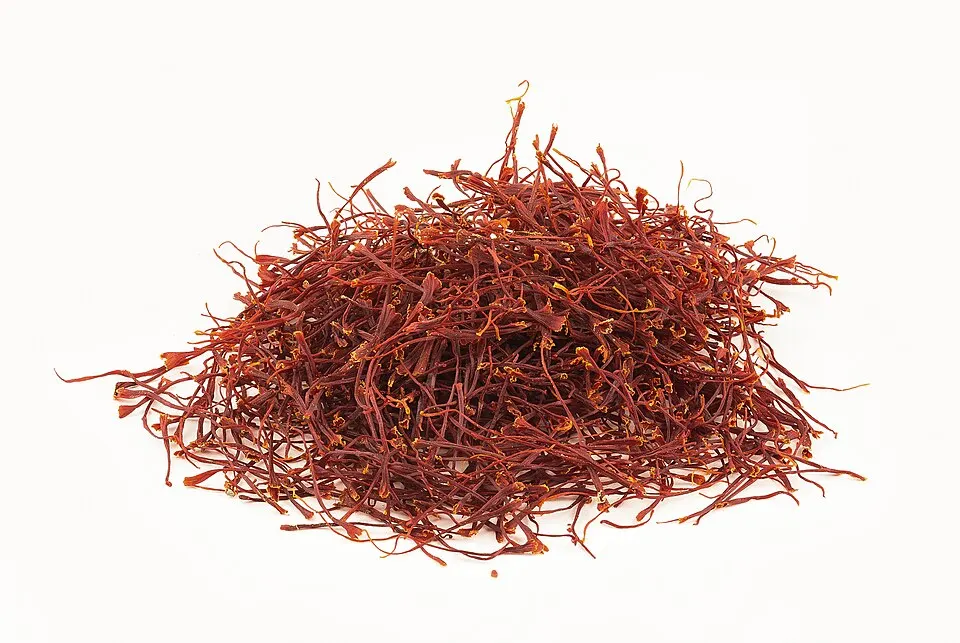 Fine deep-red threads of a spice in a small dish.