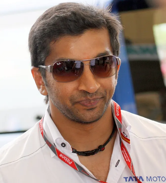 A racing driver in a race suit.