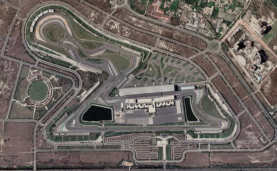 A modern race circuit with grandstands.