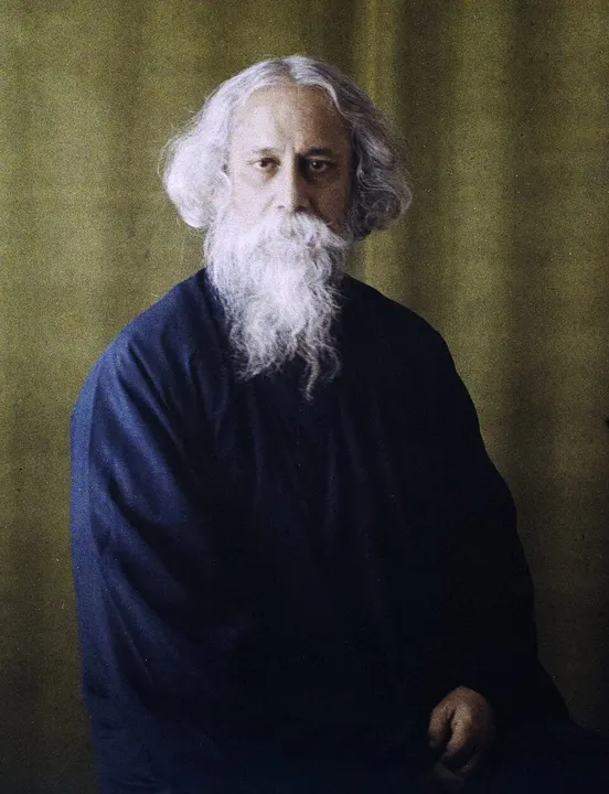 An elderly man with a long white beard and flowing white hair.