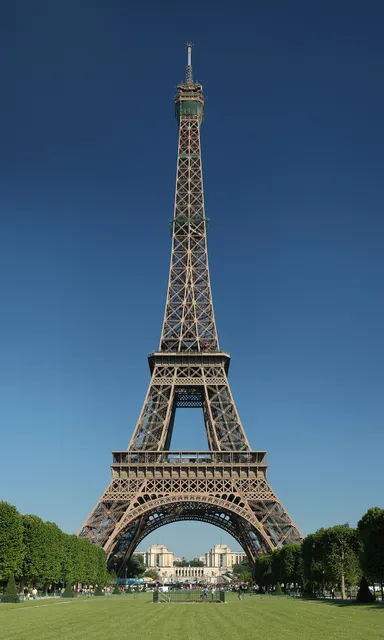 Tall iron lattice tower against a clear blue sky