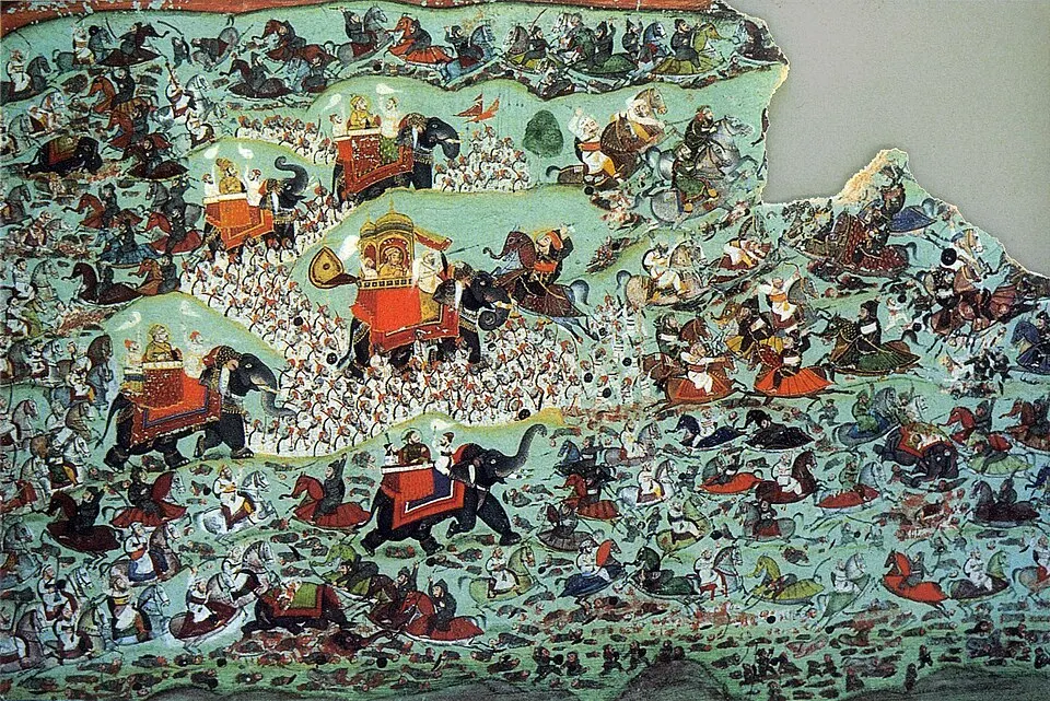 हाथियों, घुड़सवारों और पैदल सैनिकों से भरे युद्ध का पारंपरिक राजस्थानी लघुचित्र, हरे रंग की पृष्ठभूमि पर।