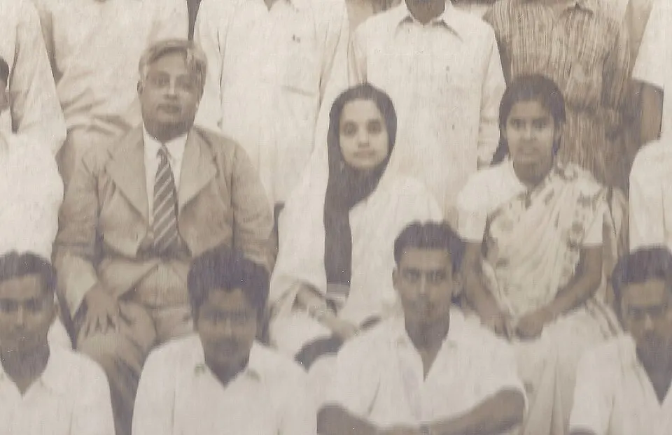 A black-and-white photo of an Indian man with a woman and a young person.