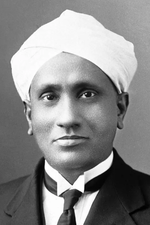 A portrait of a man in a turban and dark coat.